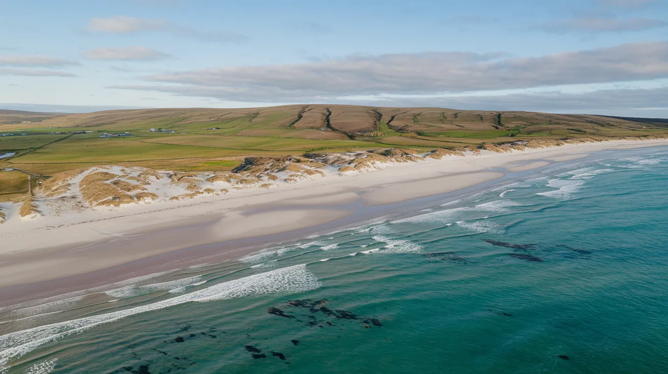 Aerial view of a stunning white sand beach and dunes on Sanday, Orkney.
