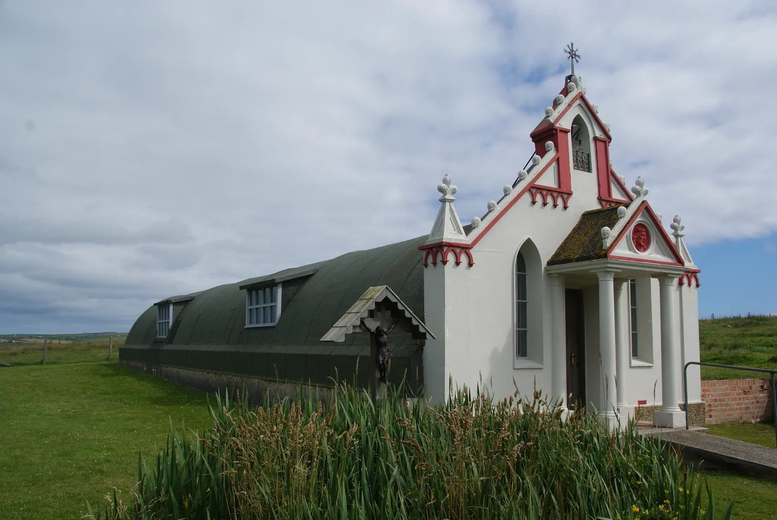 The white-painted Italian Chapel on Lamb Holm, Orkney, with its ornate concrete facade and bell tower