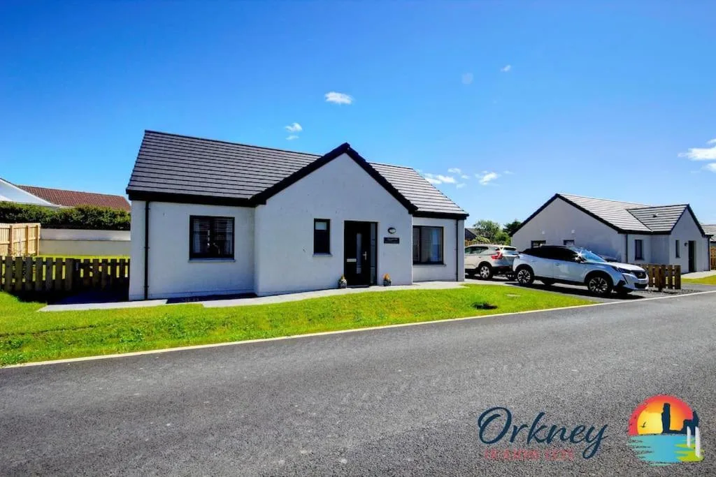 Algarth, a two-bedroom holiday home in central Stromness on the flagstone-paved town spine, with views over Hamnavoe harbour from the upstairs sitting room