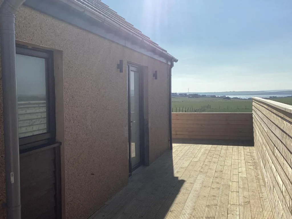 Loanside Lodge in Holm, a contemporary self-catering apartment with private terrace and garden views, on the road to St Margarets Hope south of Kirkwall