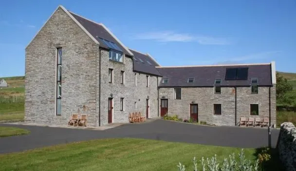 Woodwick Mill in Evie, a restored stone watermill on the North Mainland of Orkney with two apartments in the converted Kiln and Sheafy buildings, set in private grounds with river and garden views and the sea ten minutes walk away