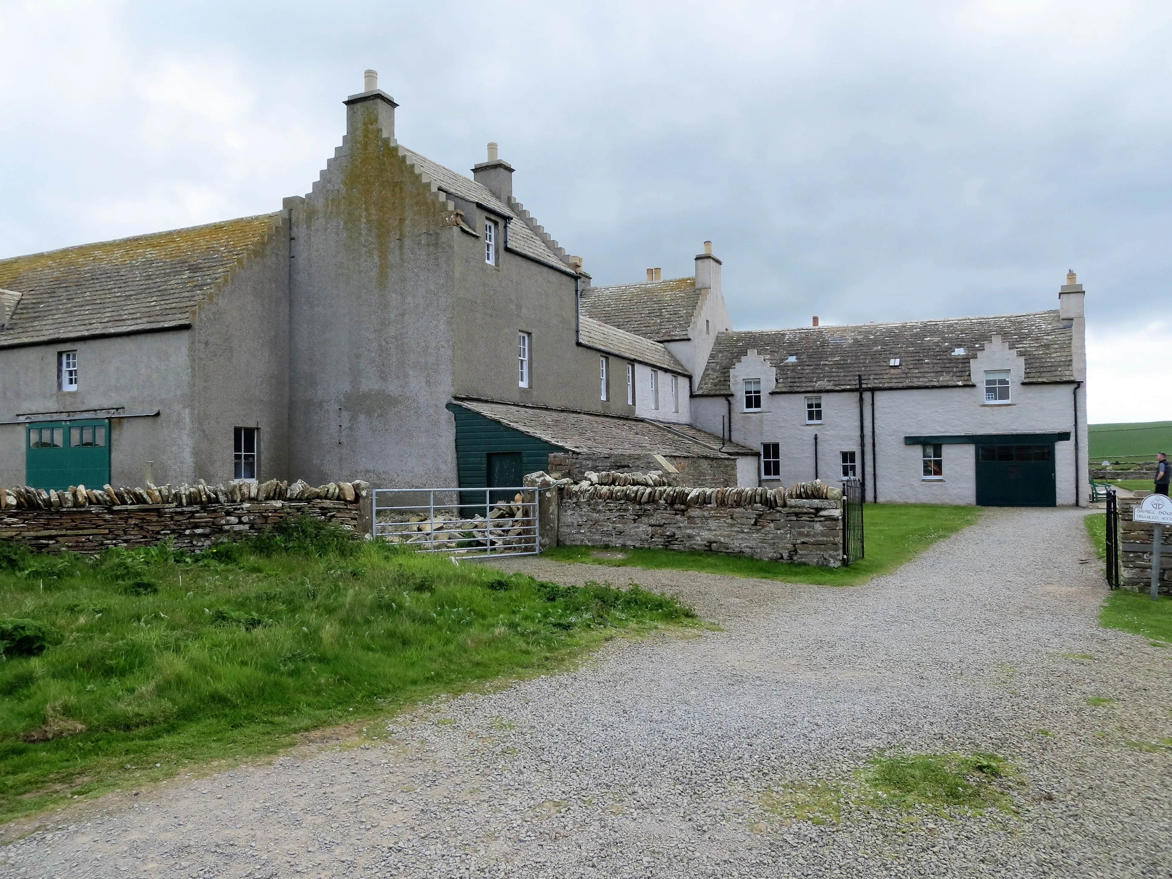 Skaill House, a 17th-century Orkney laird's mansion built beside the Skara Brae Neolithic site, with traditional stone walls and stepped chimney gables