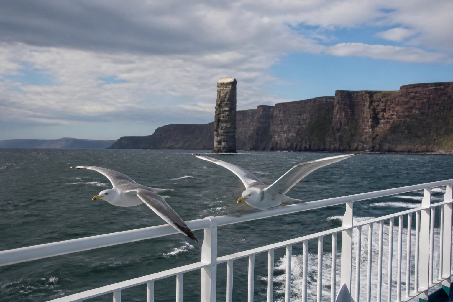 The Old Man of Hoy sea stack viewed from the open deck of the MV Hamnavoe ferry crossing the Pentland Firth between Scrabster and Stromness, where to stay on Hoy Orkney