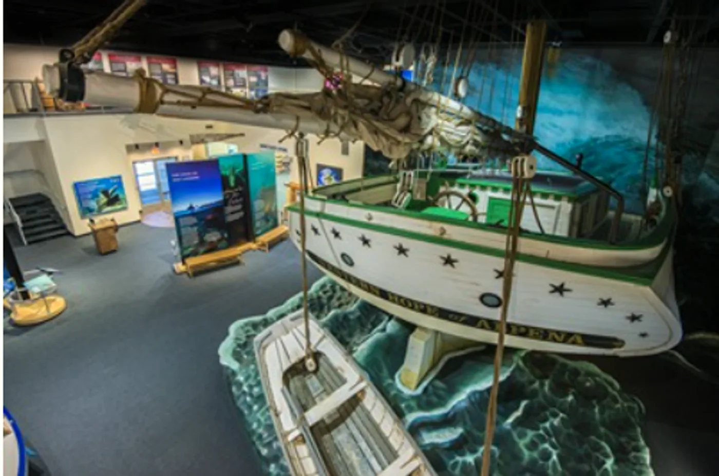 Interior of the Great Lakes Maritime Heritage Center in Alpena, Michigan, showing shipwreck exhibits and scale models