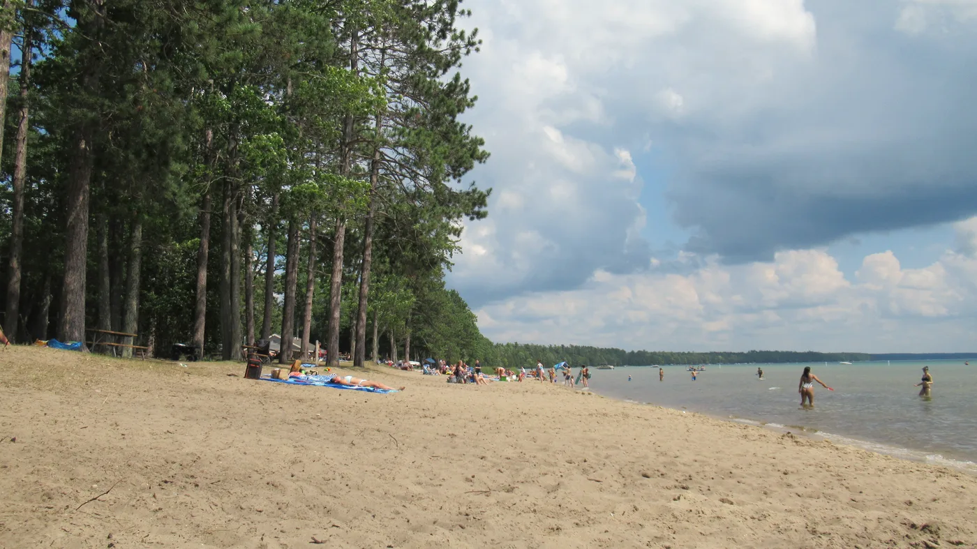 Sandy beach and clear water at North Higgins Lake State Park, Michigan