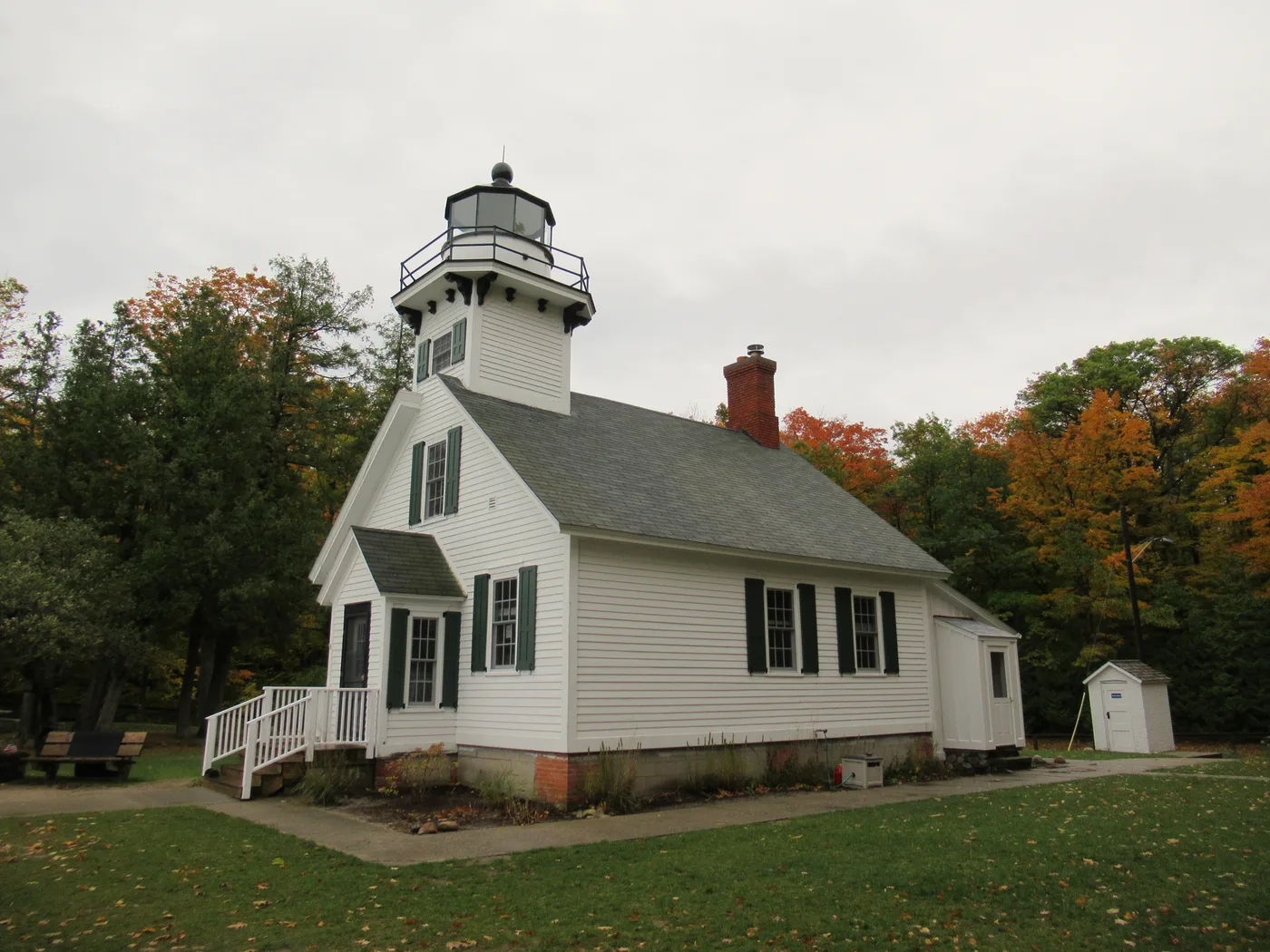 Old Mission Point Lighthouse white clapboard keeper's cottage with attached tower at the tip of Old Mission Peninsula in Grand Traverse Bay, Michigan