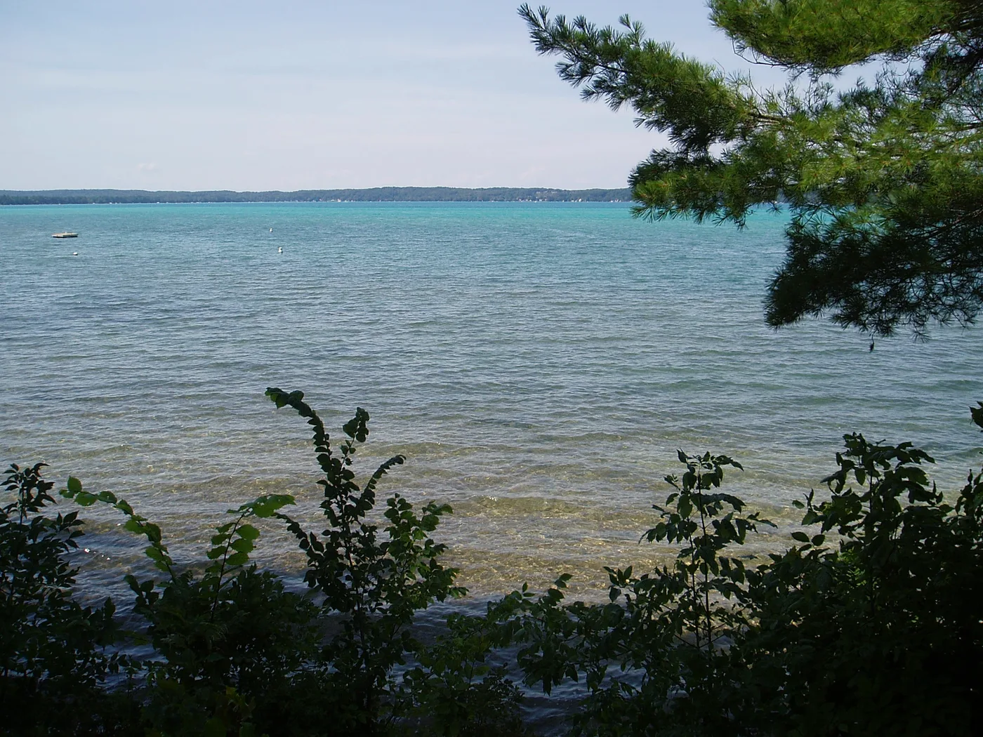 Aerial view of Torch Lake in Antrim County Michigan showing brilliant turquoise and blue water