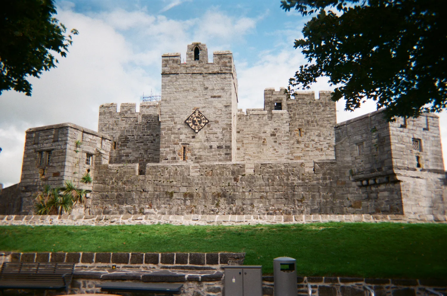 The pale limestone keep of Castle Rushen with its diamond-shaped clock face and battlemented towers