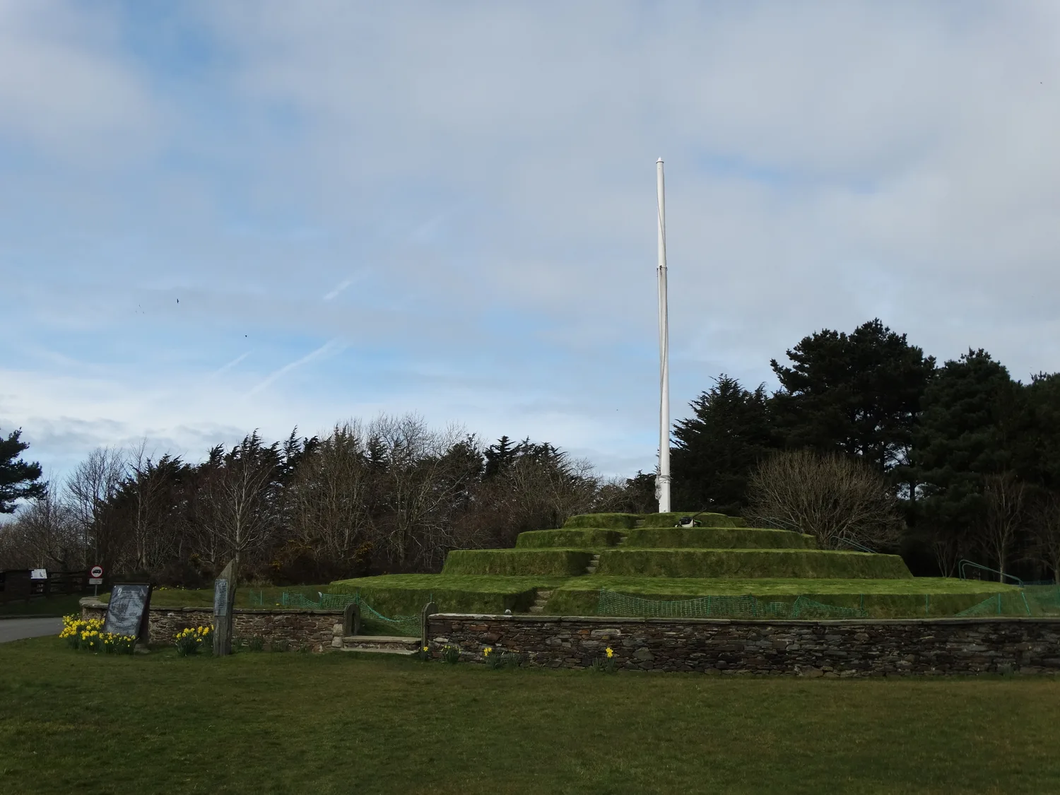 The grassed stepped tiers of Tynwald Hill at St John's with its tall white flagstaff