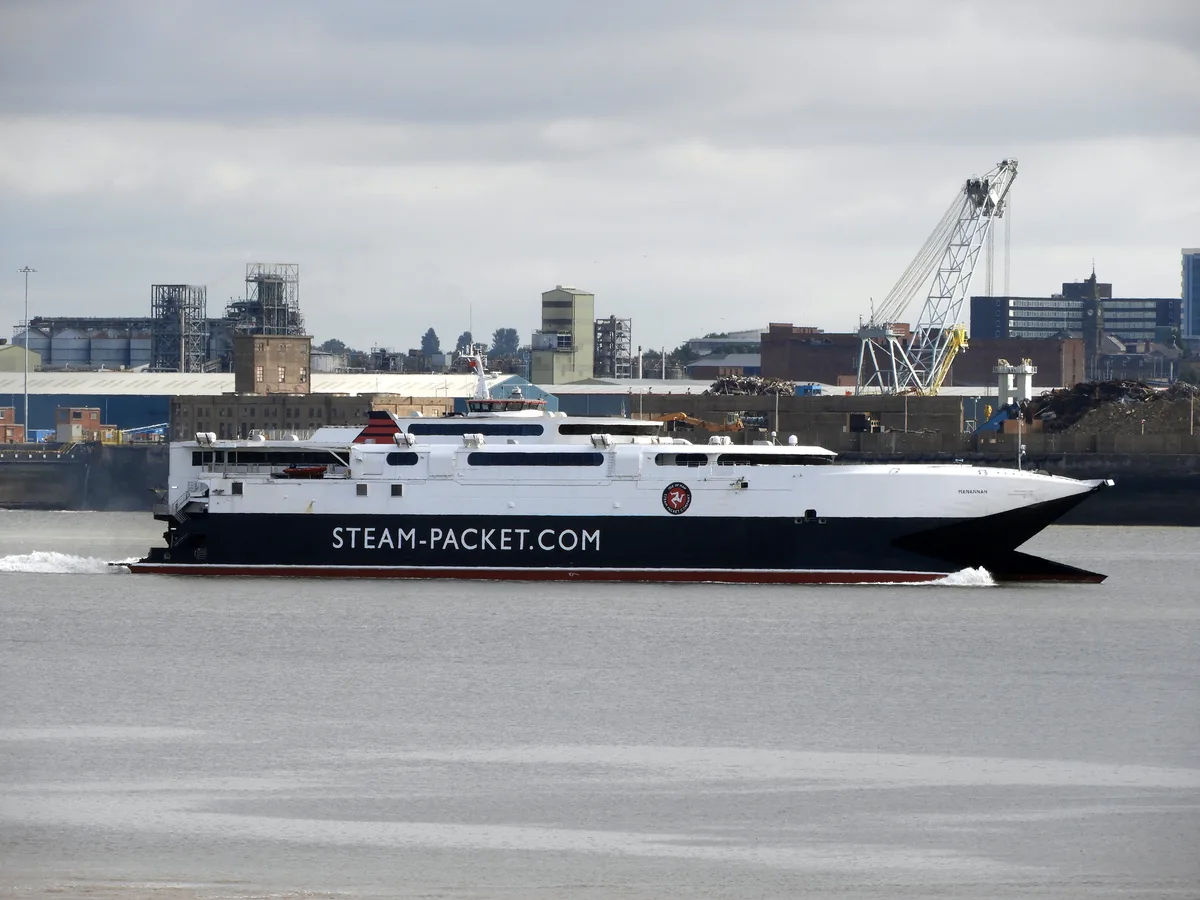 The high-speed catamaran Manannan arriving at Liverpool, with the city's dockside cranes behind