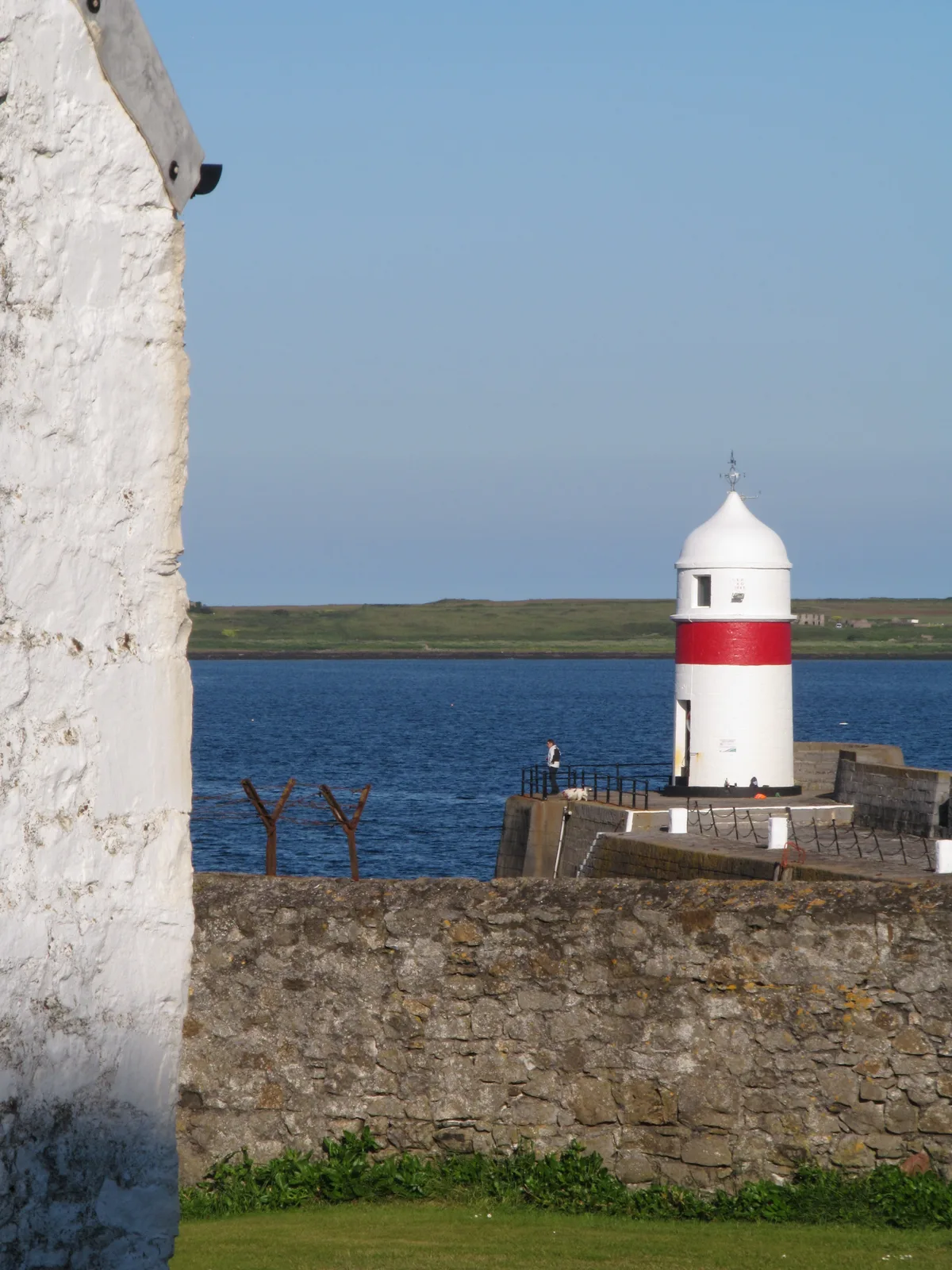 Castletown harbour with boats moored along the quay