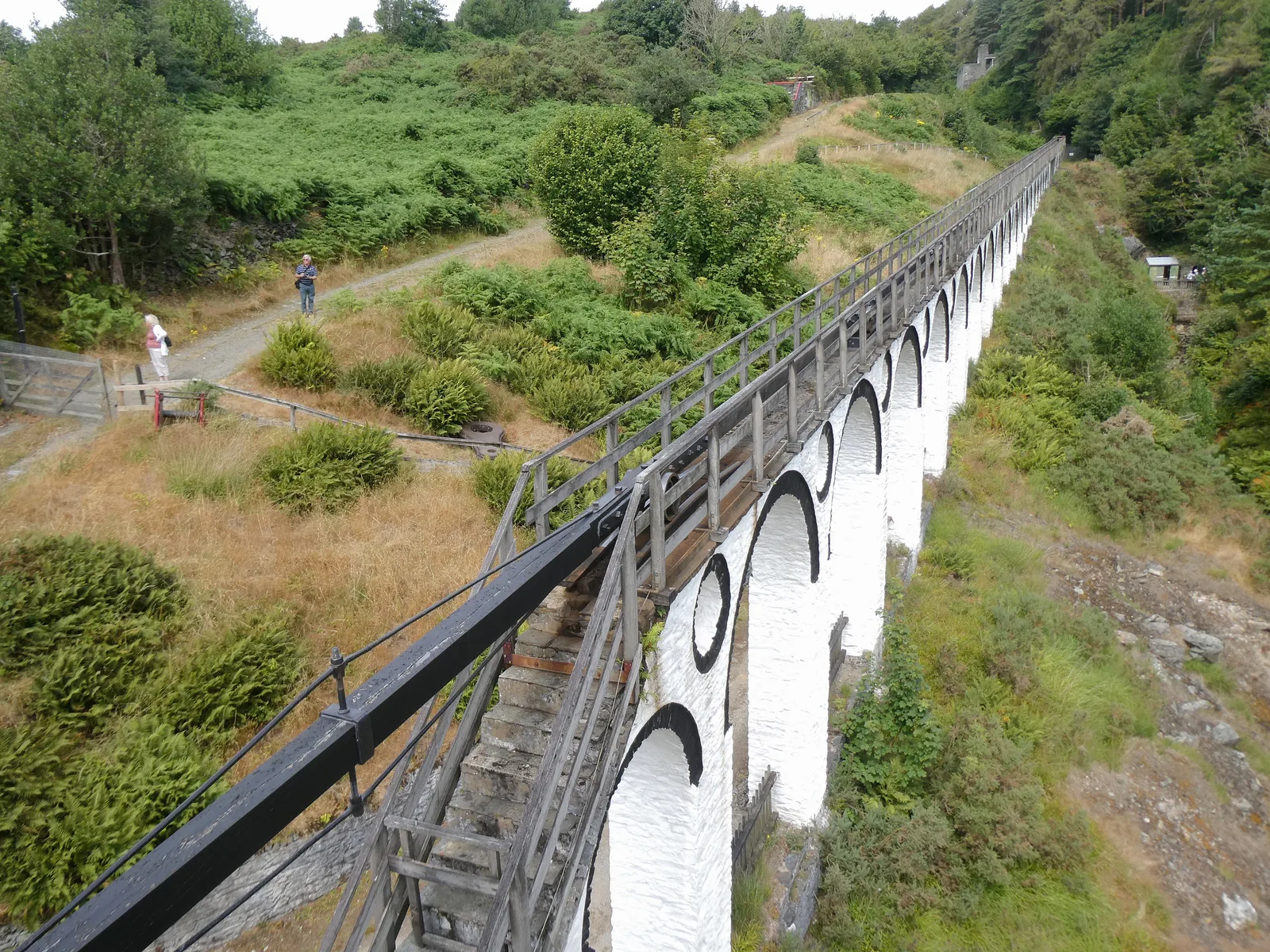 Looking down the length of the rod duct on top of the viaduct from the Laxey Wheel end, towards the glen