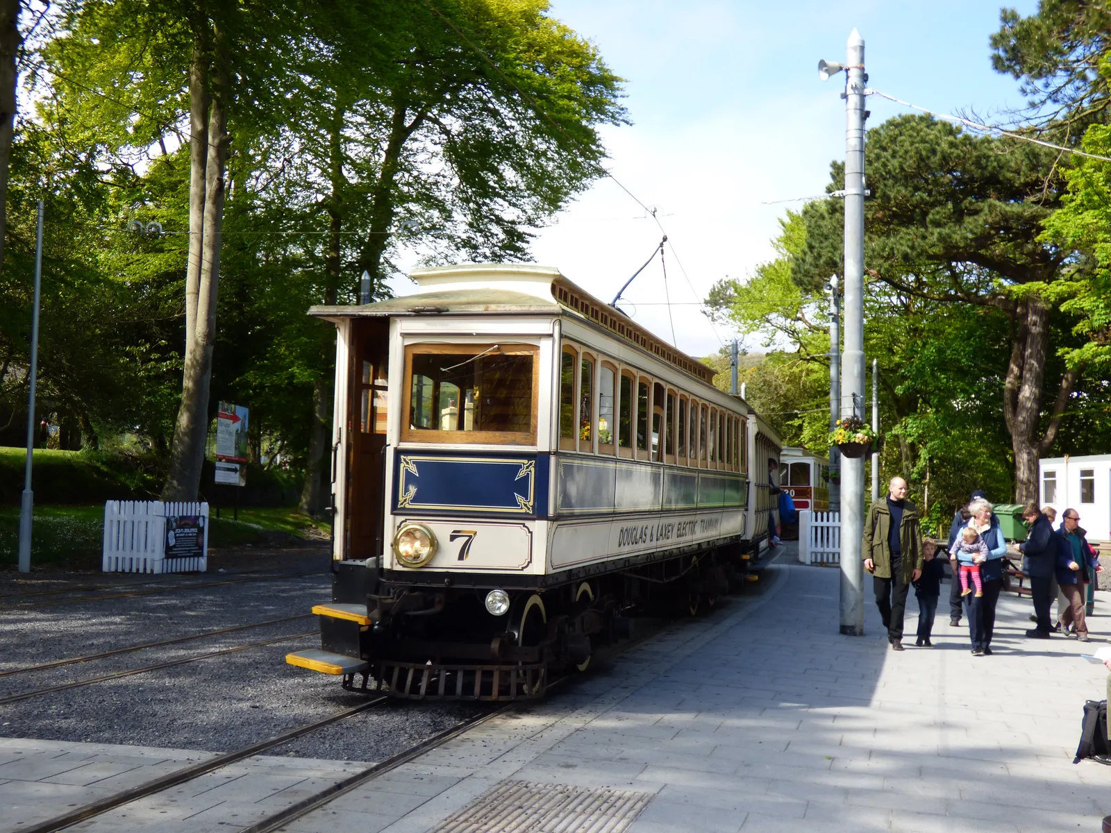 Manx Electric Railway car No 7 waiting at the platform of Laxey station under tall trees