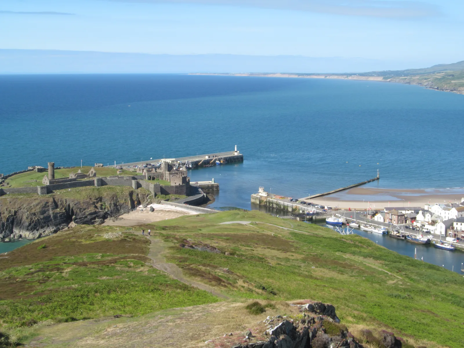 Peel Castle on St Patrick's Isle seen across the sand of Peel beach
