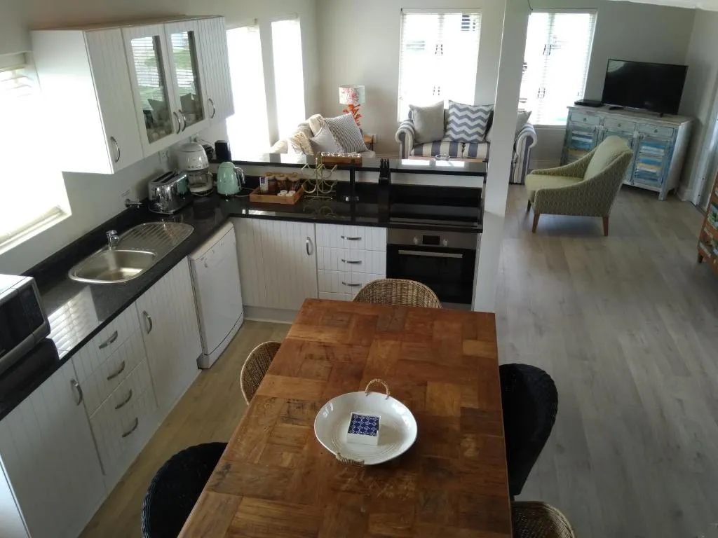 Elevated view of the open-plan kitchen, dining table and lounge area