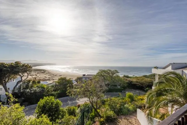 Elevated view over the beach and ocean from the property's balcony