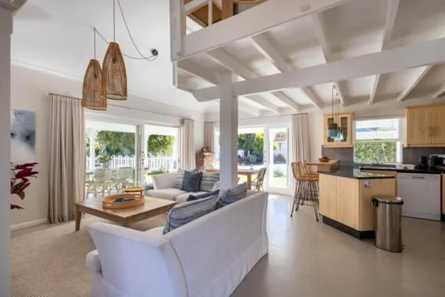 Kitchen and dining area opening through French doors onto the garden