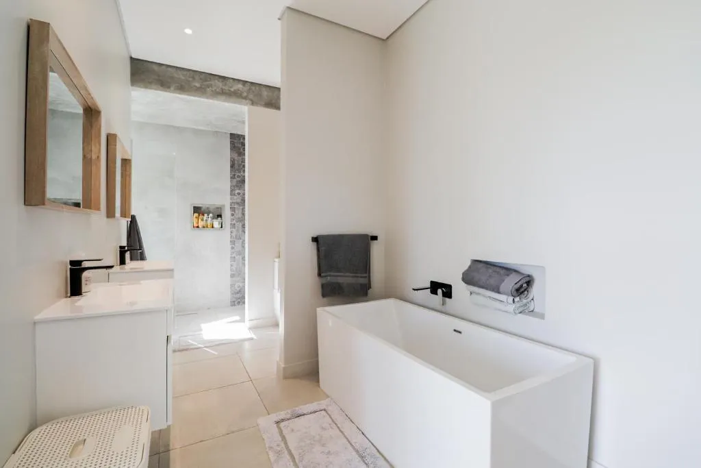Bathroom with a freestanding tub, double vanity and separate walk-in shower