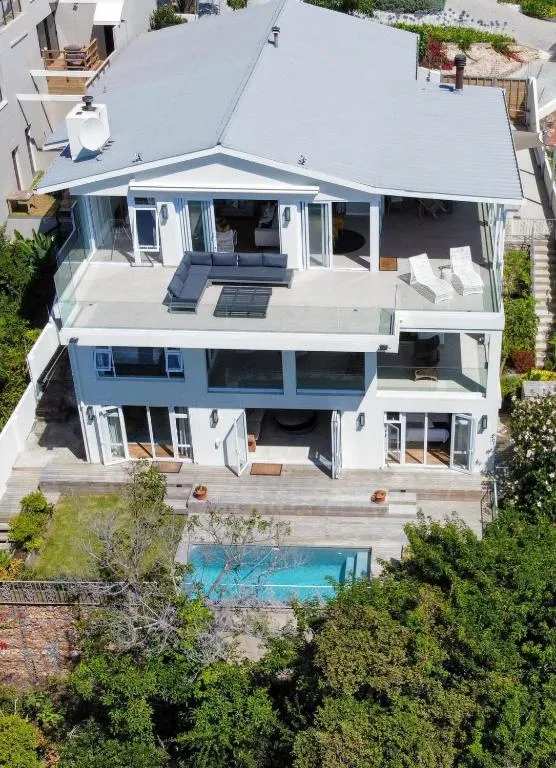 Aerial view of the multi-level villa with roof terrace, pool and garden