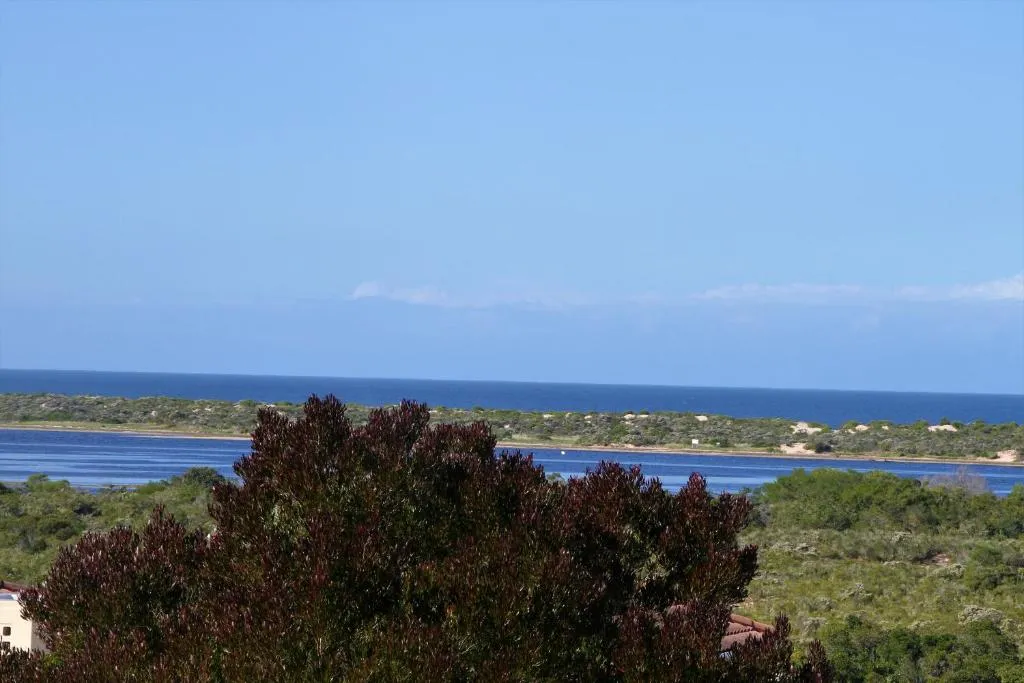Panoramic view of the Keurbooms lagoon meeting the sea beyond the dune belt
