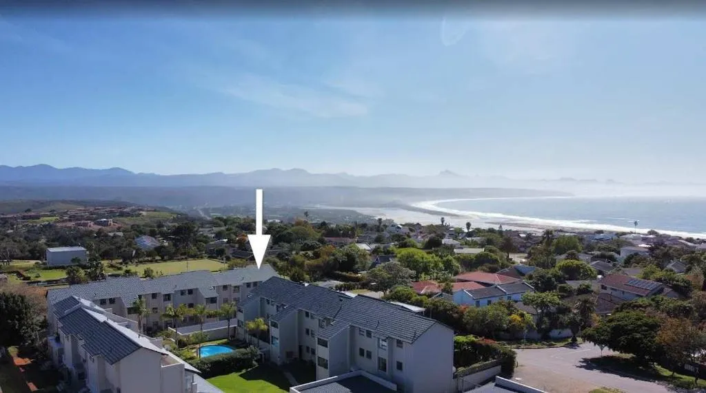 Aerial view marking the apartment block among the complex, a short walk from the beach