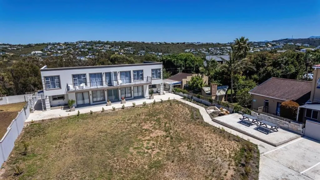 Aerial view of the two-storey apartment block, lawn and picnic area