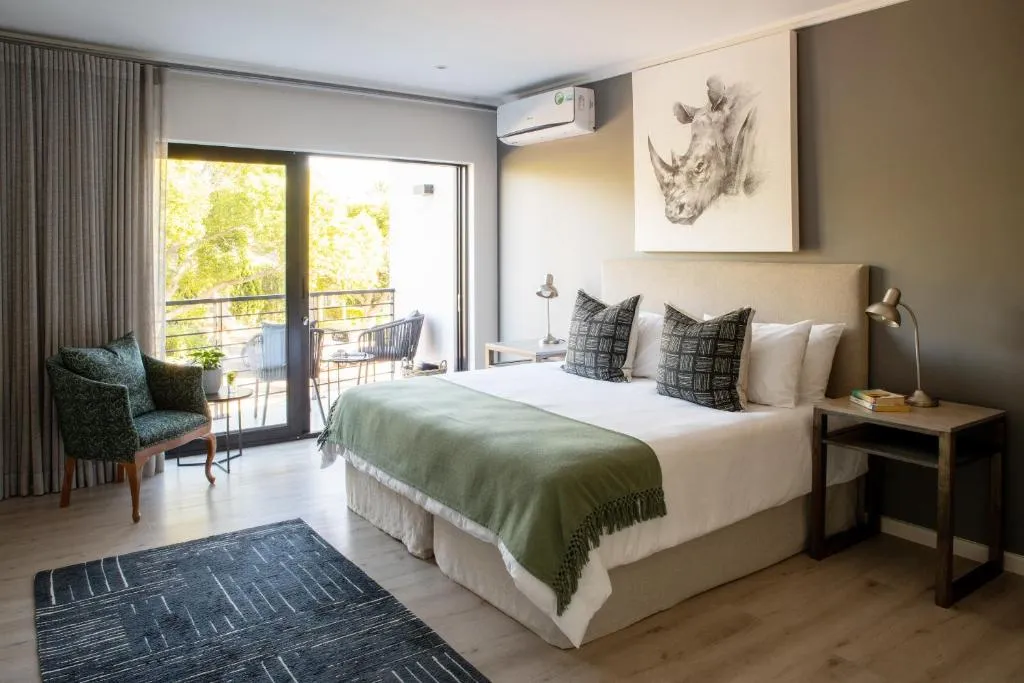 Bedroom with air-conditioning unit and sliding doors onto a balcony