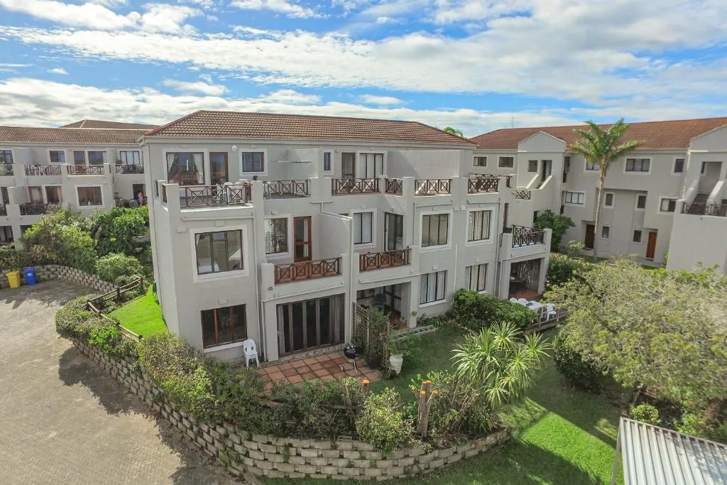 Aerial view of the apartment block's courtyard garden, balconies and a braai patio