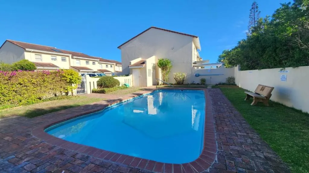Shared swimming pool in the surrounding townhouse complex, not private to this apartment