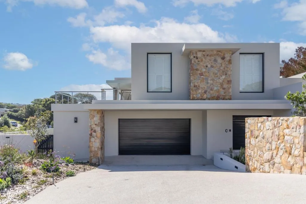 Modern double-storey villa with a natural stone feature wall and double garage