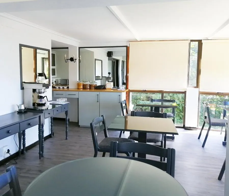 Breakfast room with a self-service coffee and tea station and dining tables