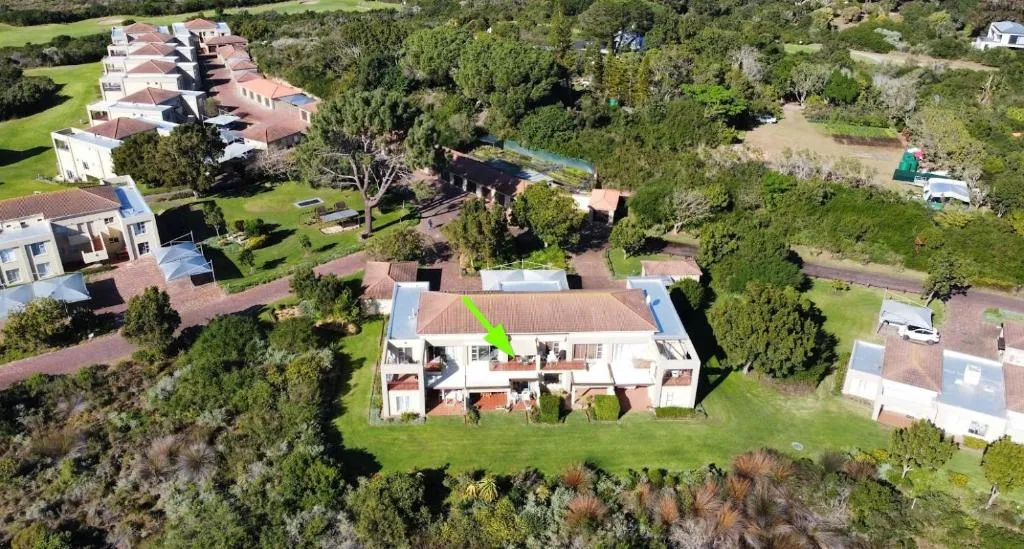 Aerial view of the two-storey building and grounds within Goose Valley Golf Estate